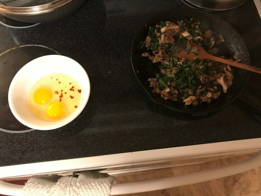 Stir the spinach into the beef mixture. Whisk the eggs and Tabasco together.
