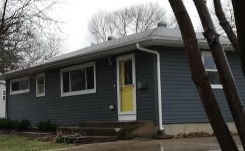 A house with a yellow door.